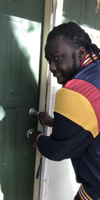 Man unlocking the door to a home